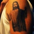 Tatuaje de Jesús cn los brazos abiertos