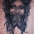 ritratto gesu' con l'occhi chiusi inchiostro nero tatuaggio