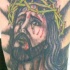 Tatuaje retrato de Jesús sangrando