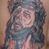 Tatuaje negro de Jesús en la corona de espias