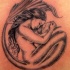 Tatuaje de serena y un niño