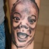 Tatuaje de un niño sonriendo