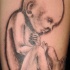 bimbo neonato inchiostro nero tatuaggio