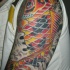 largo colorato koi sul braccio tatuaggio