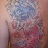 PESCI KOI TATUAGGIO COLORATO SULLASCHIENA