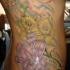 Grande tatuaggio sul fianco in stile floristico & 