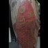 Grande tatuaggio sulla gamba la carpa rossa