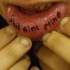 Lip tattoo, shit aint mine, black inscription