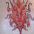 Tatouage tribal masque du soleil rouge
