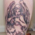el tatuaje de un angel sexy y frase 