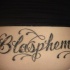 Tatuaje en el bajo de la espalda, blasphemy, con decoración