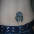 Tatuaje del león en el bajo de la espalda