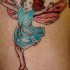 el tatuaje de una hada bailando hecho en varios colores