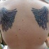 El tatuaje de alas en la espalda