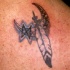 Luna e piume mezzaluna tatuaggio