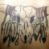 Cranio di toro con piume tatuaggio