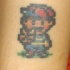 tatuaje colorido de 8 bit ness
