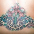 Ornamento di orchidee  tatuaggio sulla schiena