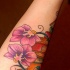 Orchidea viola e libre tatuaggio