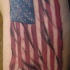 Bandiera americana tagliata tatuaggio