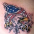 Bandiera amricana e aquila sotto pelle stracciata tatuaggio