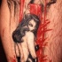 el tatuaje de unachica diabliada y una calavera sangrando