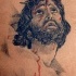 Gesu con corona di spine con sangue tatuaggio