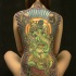 Tatto di ganesha fatto in verde su schiena