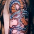 Tatouage impressionnant serpent biomécanique couleurs vives