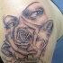 Tatuaje de cara con la rosa en lugar de boca