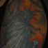 Tatuaggio colorato sul deltoide la Statua della Libertà