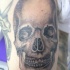 Realística calavera humana tatuaje clásico