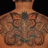 Tatuaggio grande sulla schiena la farfalla & i serpenti