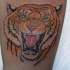 Tatuaje clásico cabeza del tigre rugiendo