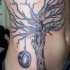 Tatuaje del árbol en vientre
