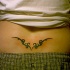 Le tatouage tribal du bas du dos