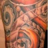 Serpent orange dans les nuages le tatouage
