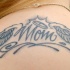 Tatuaggio sulla schiena la scritta 