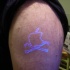 mela logo uv inchiostro tatuaggio