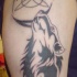 Un signe tribal avec le tatouage de loup
