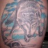 Tatouage de loup avec le ciel bleu