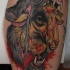 Tatuaje en la pierna, lobo salvaje que come a oveja