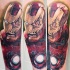 Terrifying looking colored arm tattoo of corrupted Iron-man