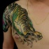 Crawling tiger  tattoo  on shoulder and chest