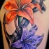 ancoraggio tradizionale e fiori tatuaggio