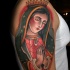 Traditional old school style praying Virgin Mary religious colored shoulder tattoo