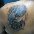 Typical black and white back tattoo of basketball player