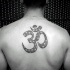 Typical black ink back tattoo of Hinduism symbol