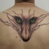 Typical black ink upper back tattoo of fox face