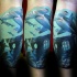 Typical multicolored leg tattoo of hammer sharks and underwater ruins
